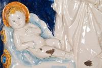 An Italian Glazed Earthenware Plaque of the Madonna and Child