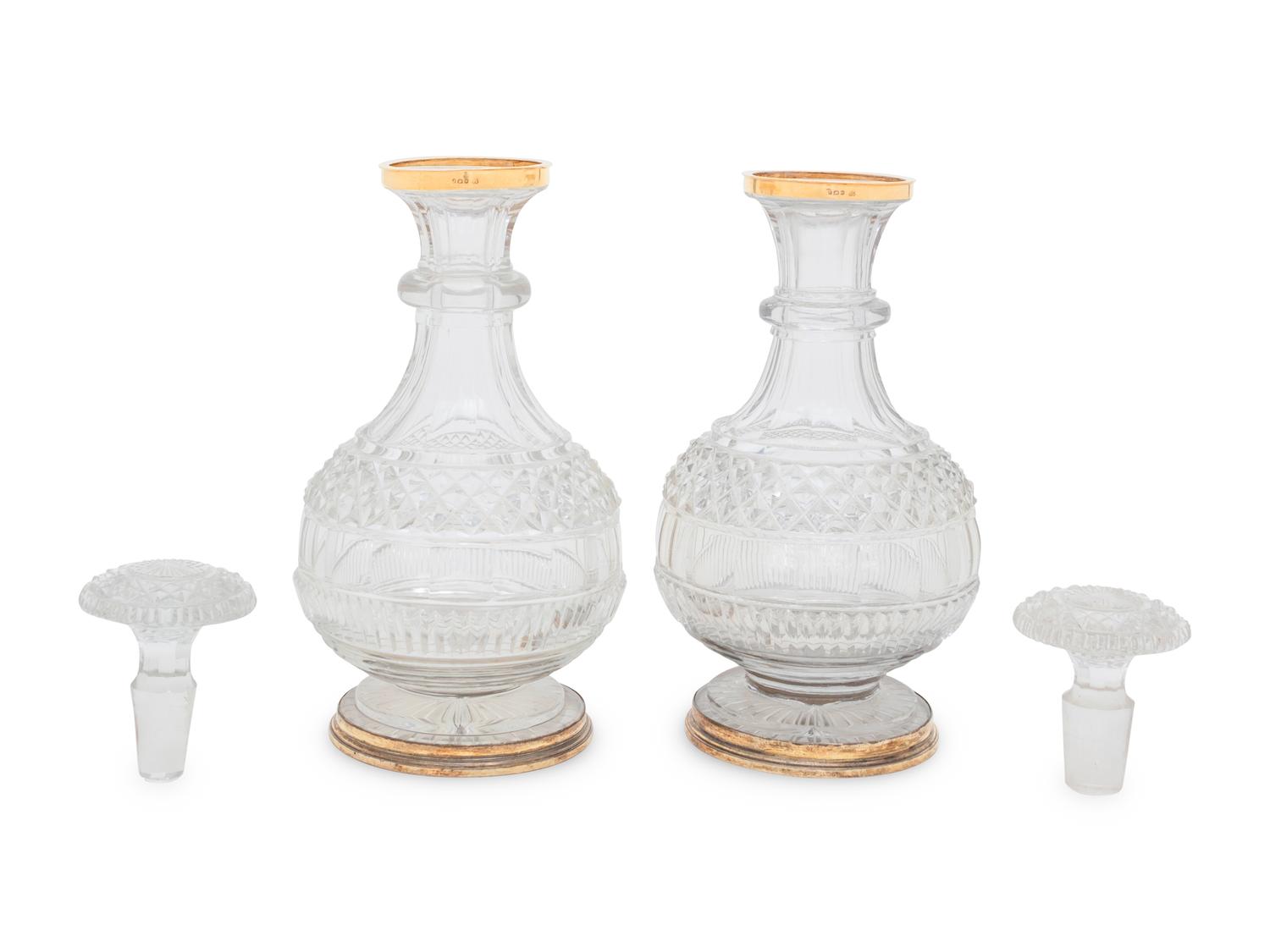 A Near Pair of George III Silver-Gilt Mounted Cut Glass Decanters