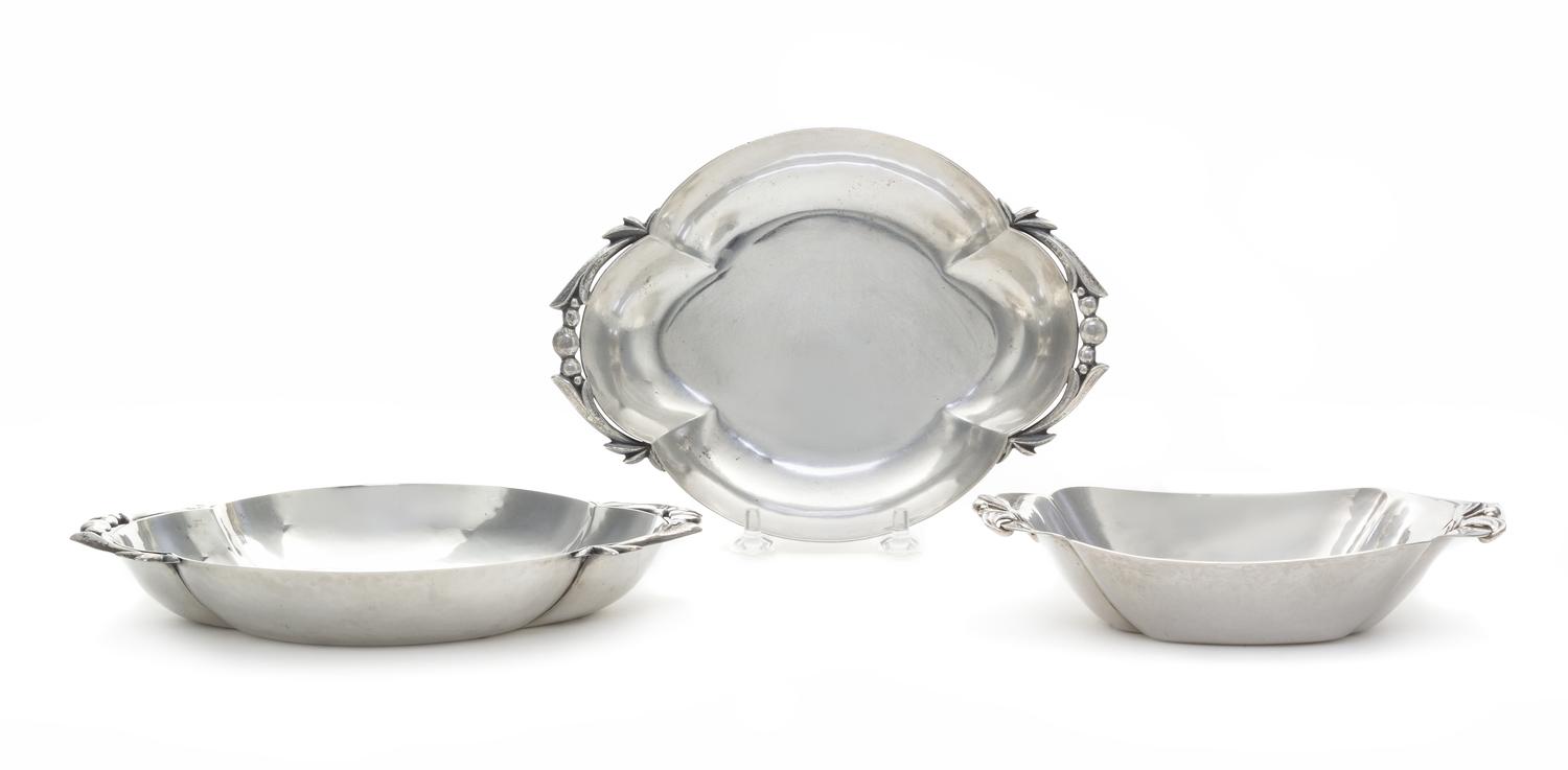 A Pair of American Silver Small Dishes, Cellini Craft, Ltd., Chicago, IL, 1940, each of shaped oval form, the ends decorated with buds