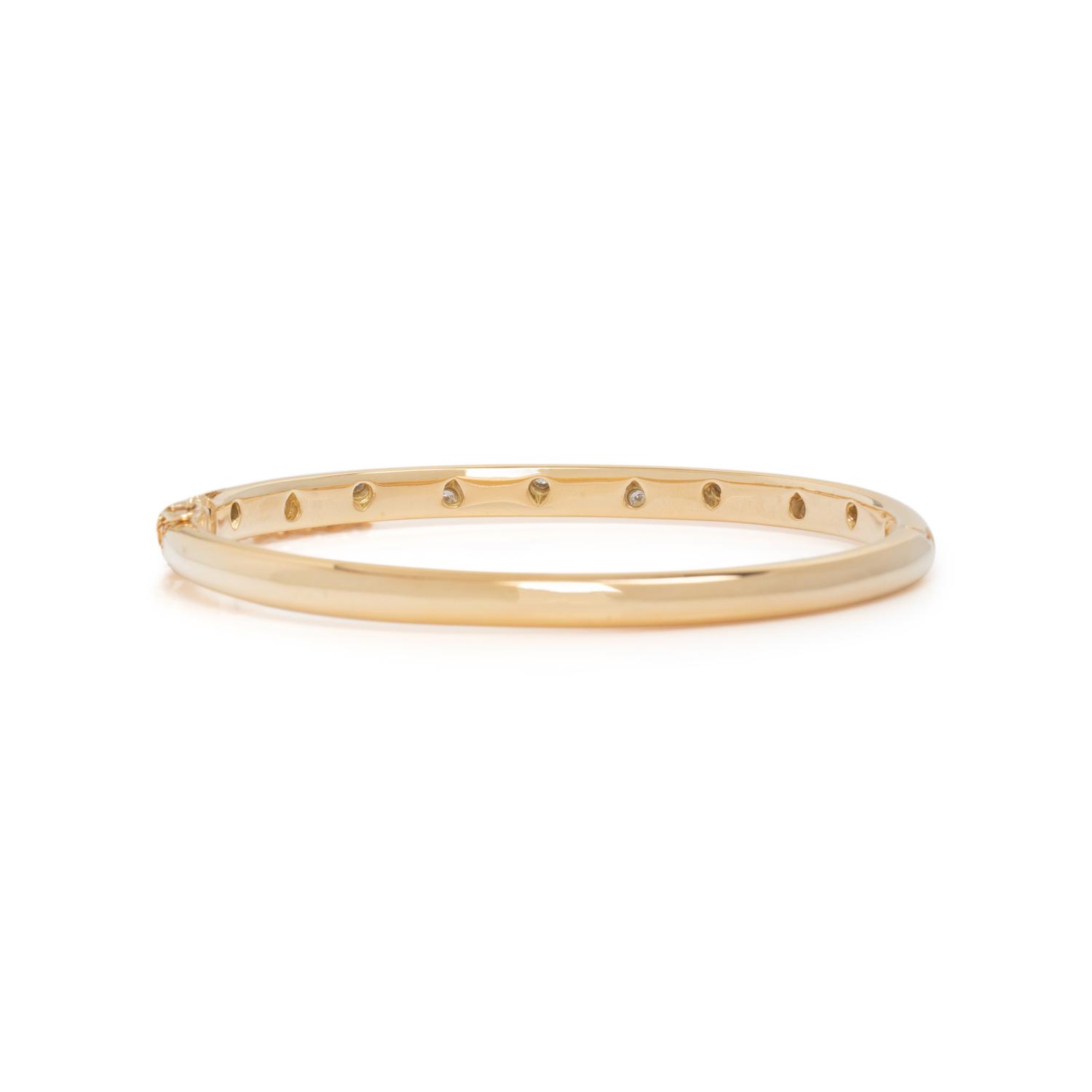 TIFFANY & CO., YELLOW GOLD, PLATINUM AND DIAMOND 'ETOILE' BANGLE BRACELET