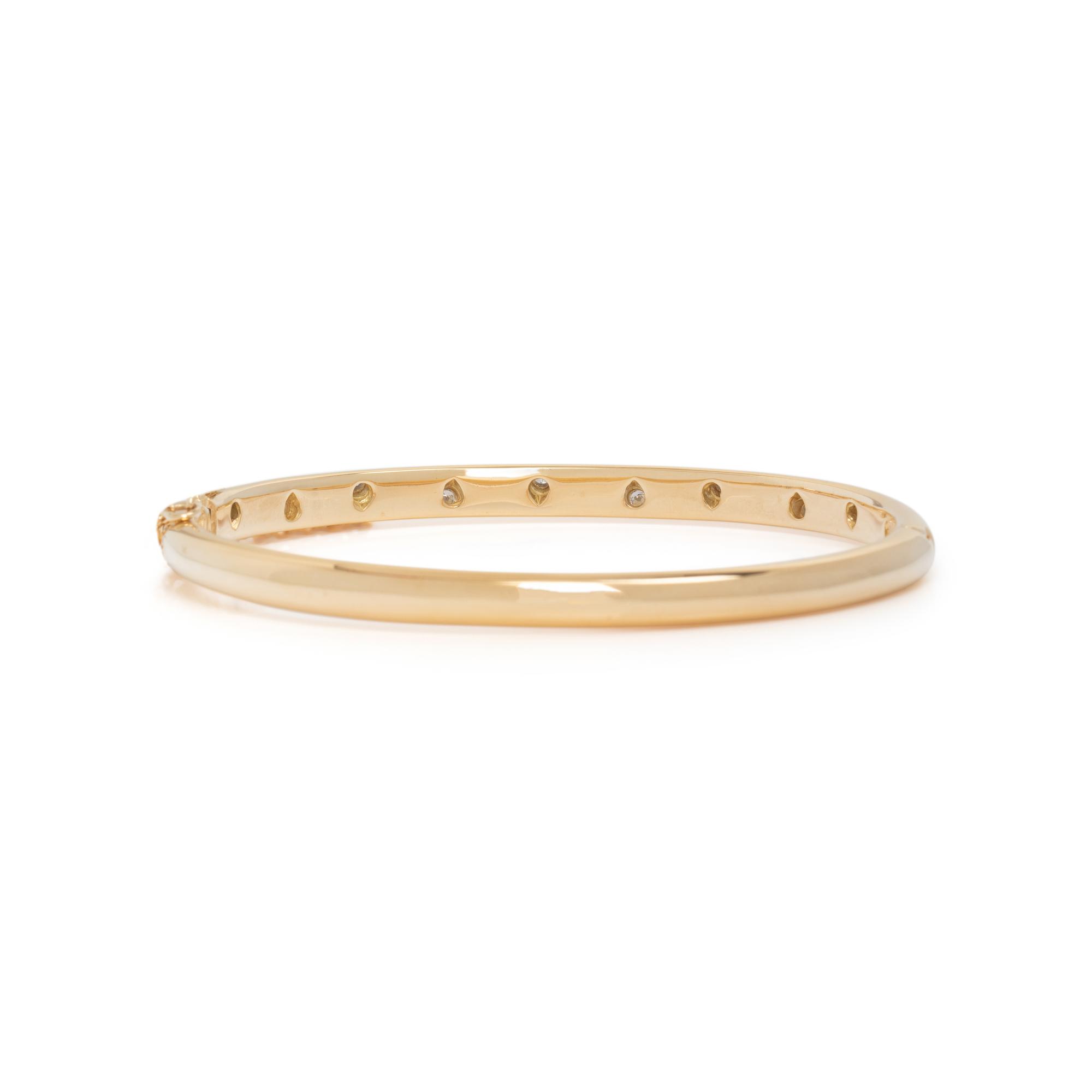 TIFFANY & CO., YELLOW GOLD, PLATINUM AND DIAMOND 'ETOILE' BANGLE BRACELET