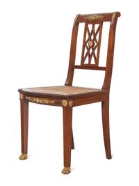 An Assembled Empire Style Gilt Metal Mounted Mahogany Dining Suite