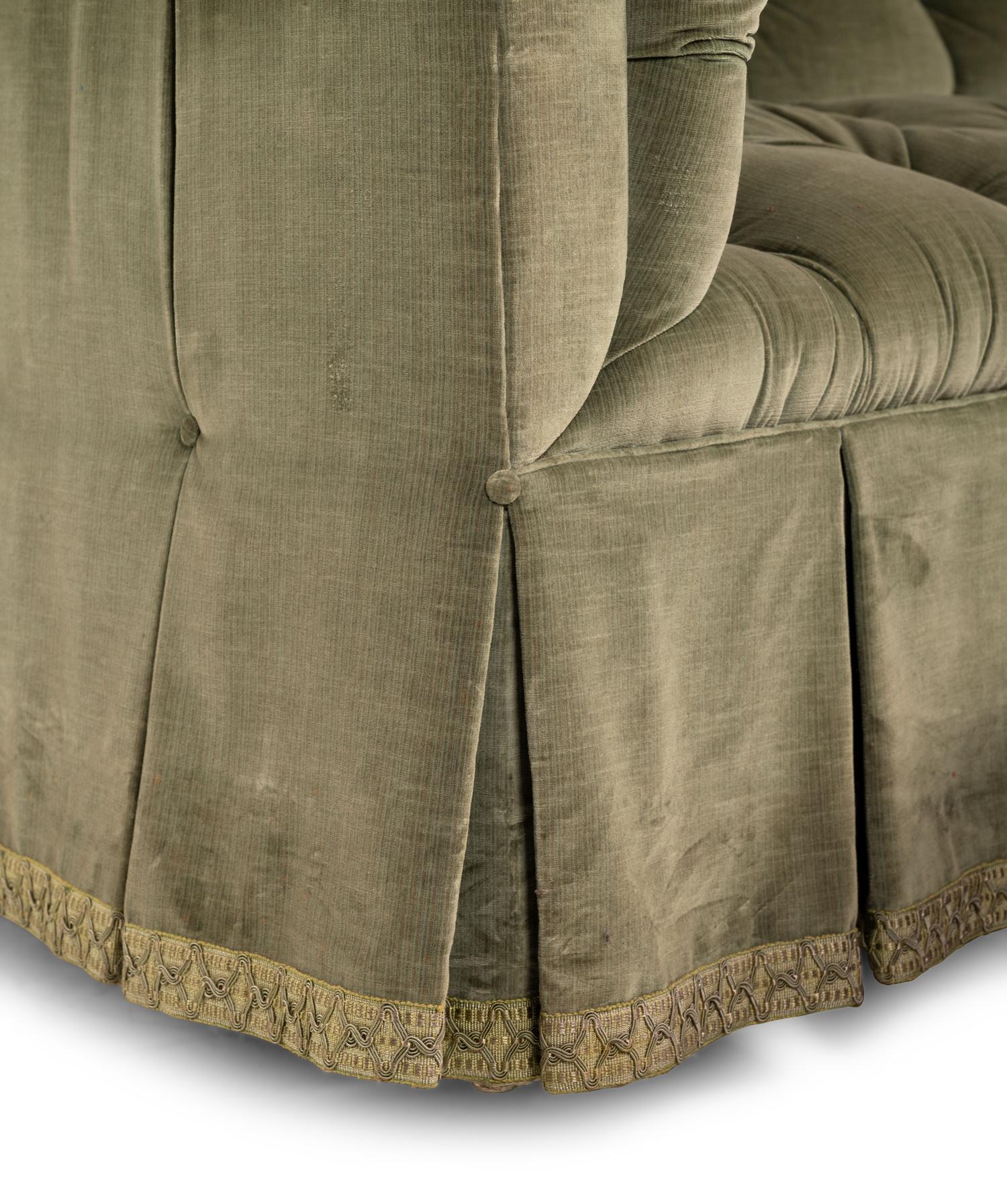 A Green Velvet Button Tufted Sofa and Ottoman