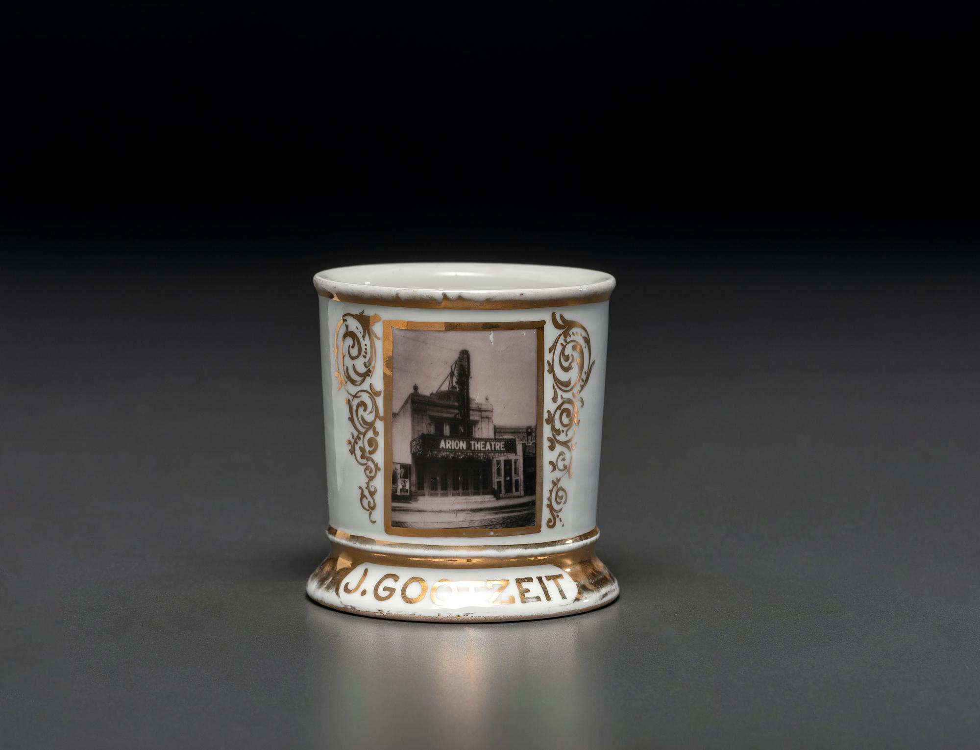 A Photographic Transfer Porcelain Shaving Mug Depicting the Arion Theatre, New York
