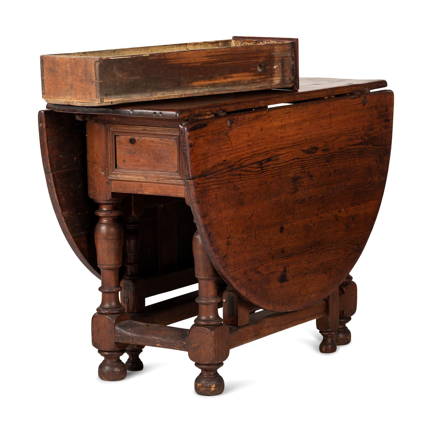 A Swedish Turned and Block Carved Pine Drop-Leaf Gate-Leg Dining Table
