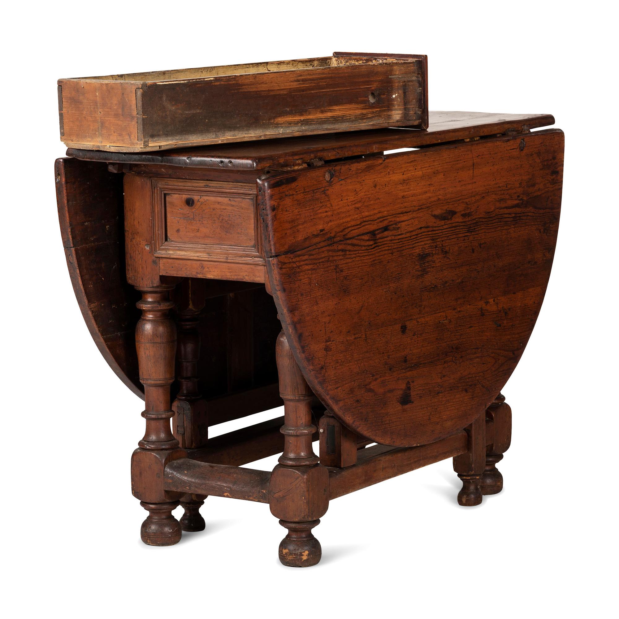 A Swedish Turned and Block Carved Pine Drop-Leaf Gate-Leg Dining Table