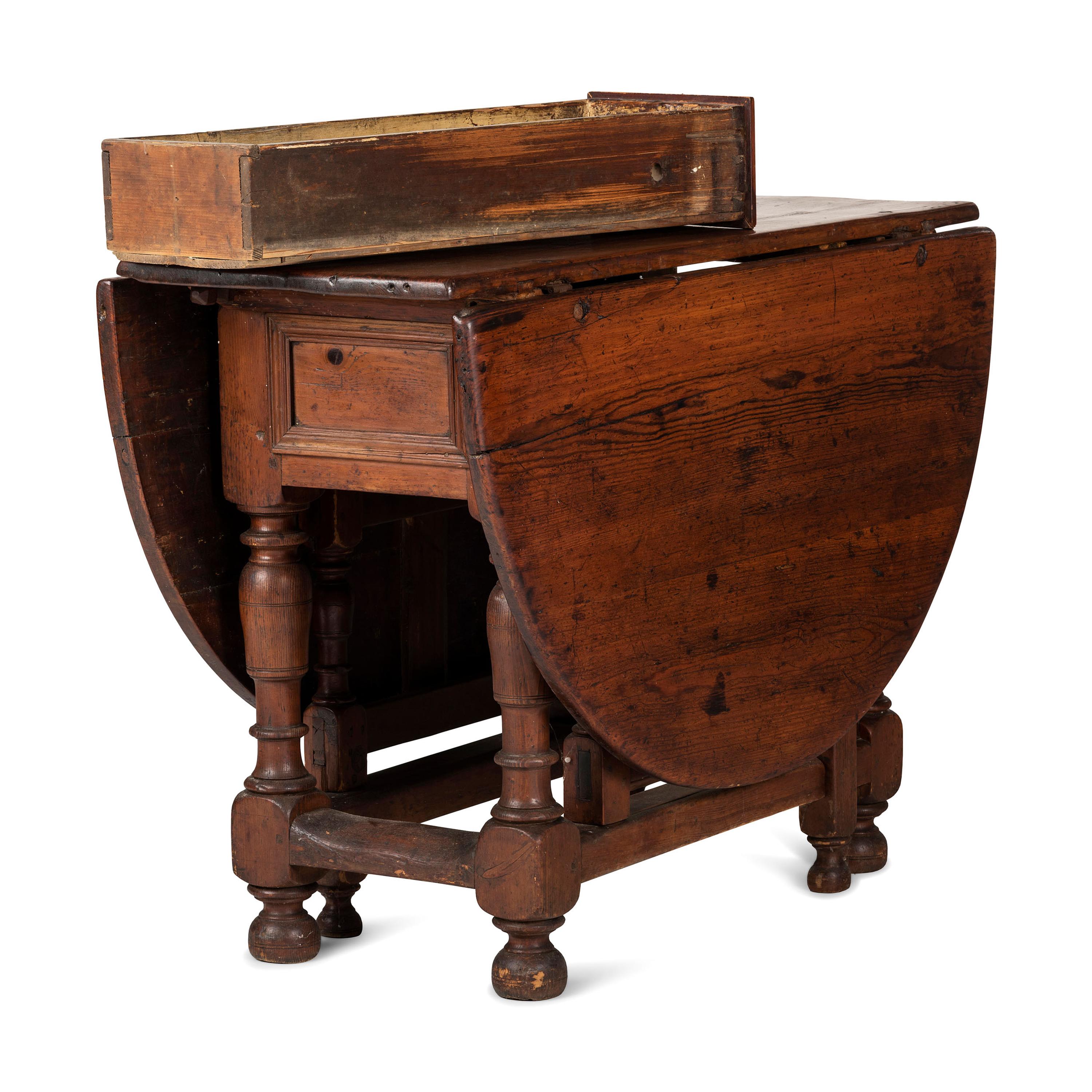A Swedish Turned and Block Carved Pine Drop-Leaf Gate-Leg Dining Table