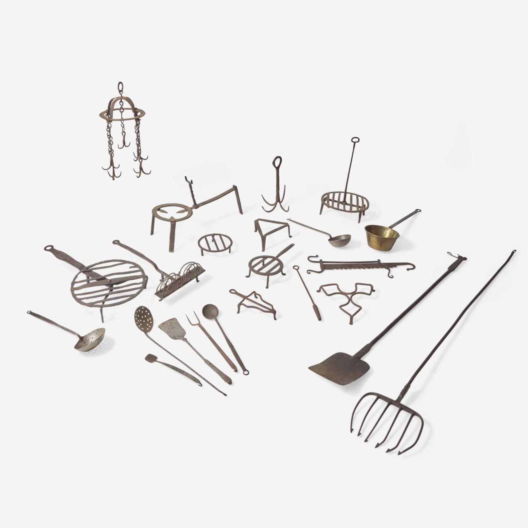 A large collection of twenty-three wrought iron cooking utensils 18th / 19th century