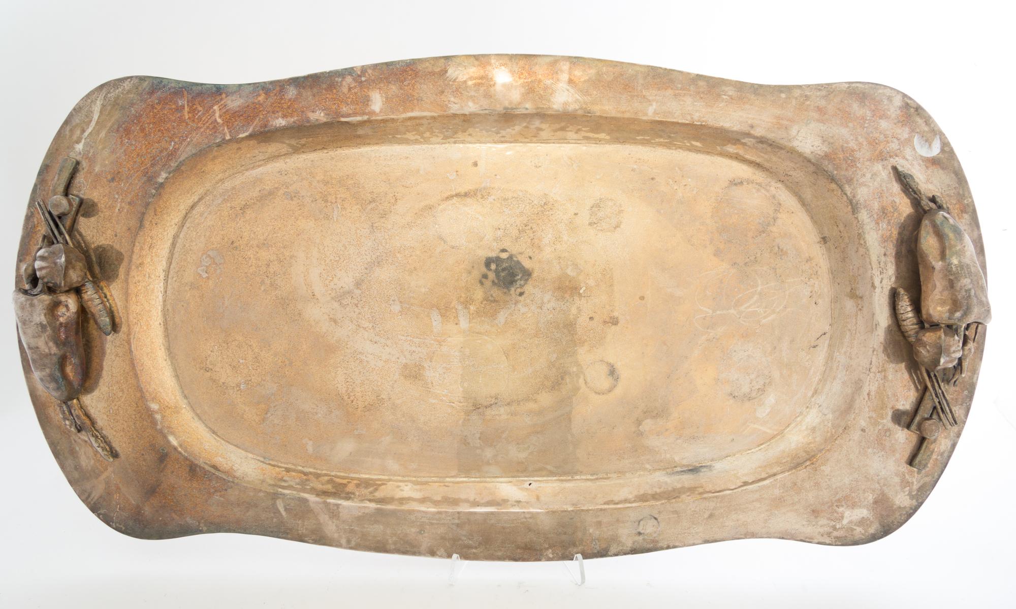A Mexican Silver-Plate Tray, 20th Century, of shaped rectangular form with realistically modeled vegetable handles and spot-hammered su