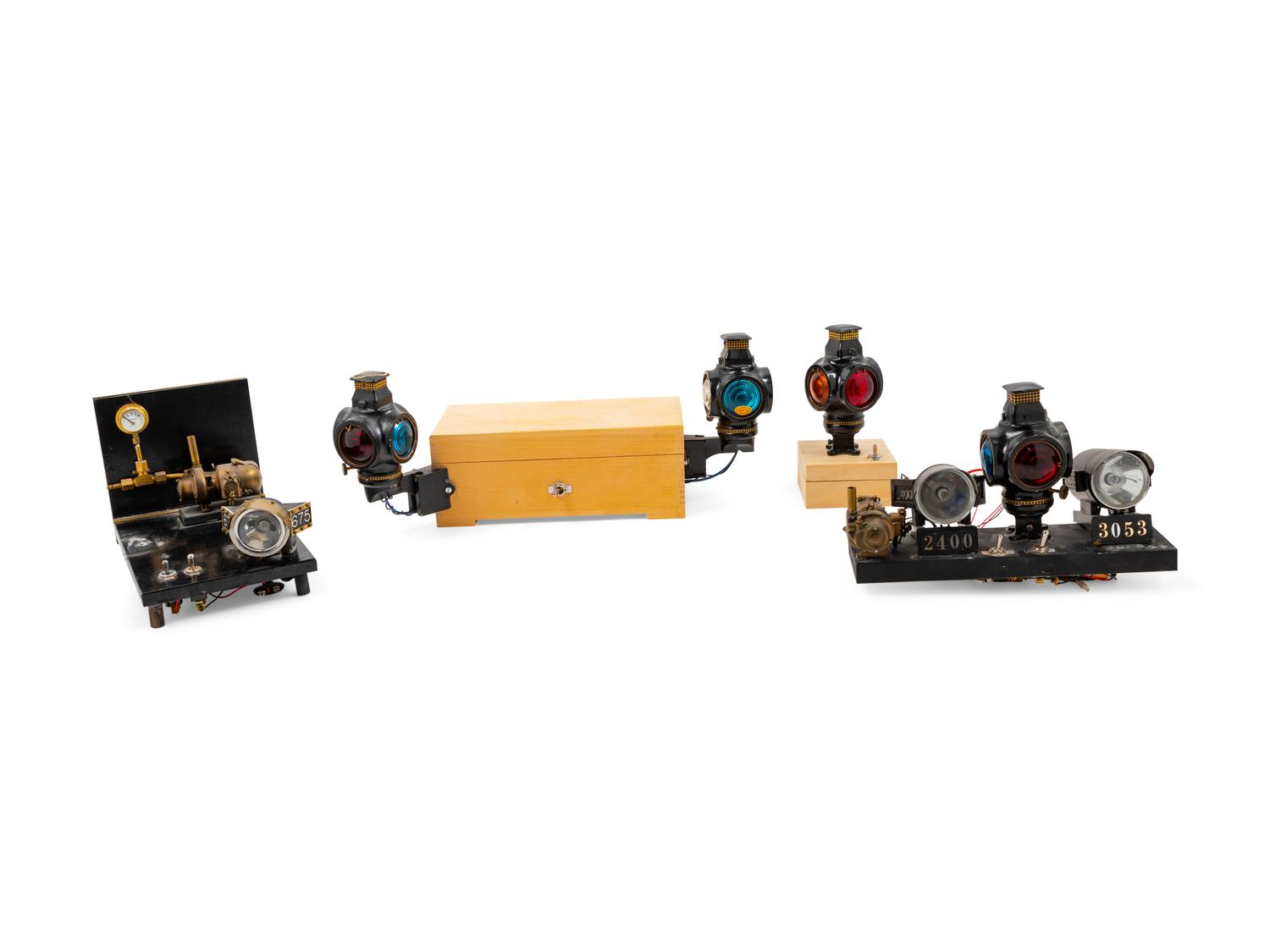 A Collection of Seven Battery Powered Diminutive Railroad Lanterns and Locomotive Headlamps