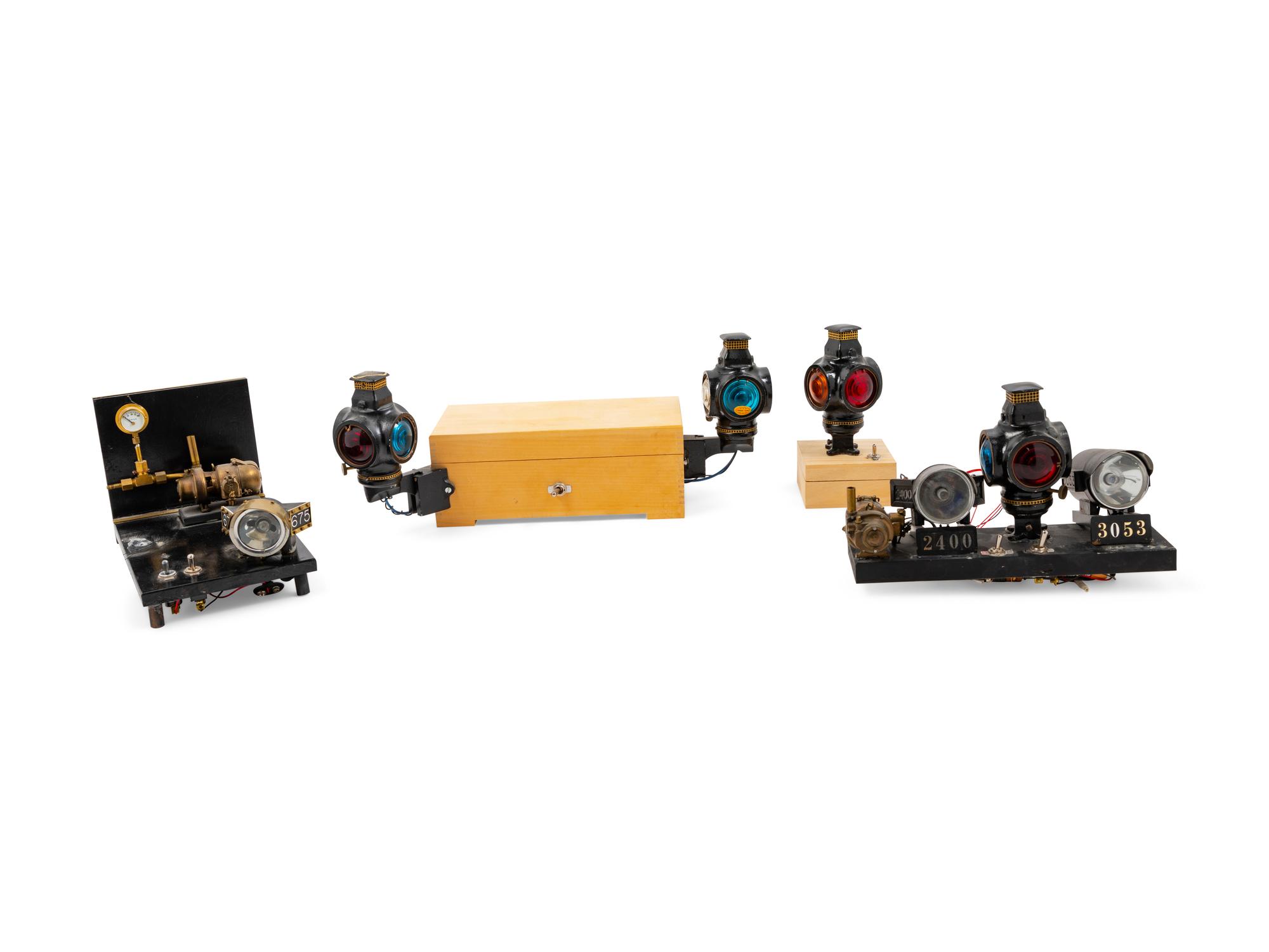 A Collection of Seven Battery Powered Diminutive Railroad Lanterns and Locomotive Headlamps