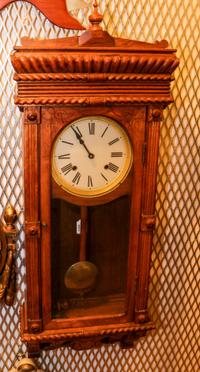 A Late Victorian Carved Oak Wall Clock. Height 38 inches.