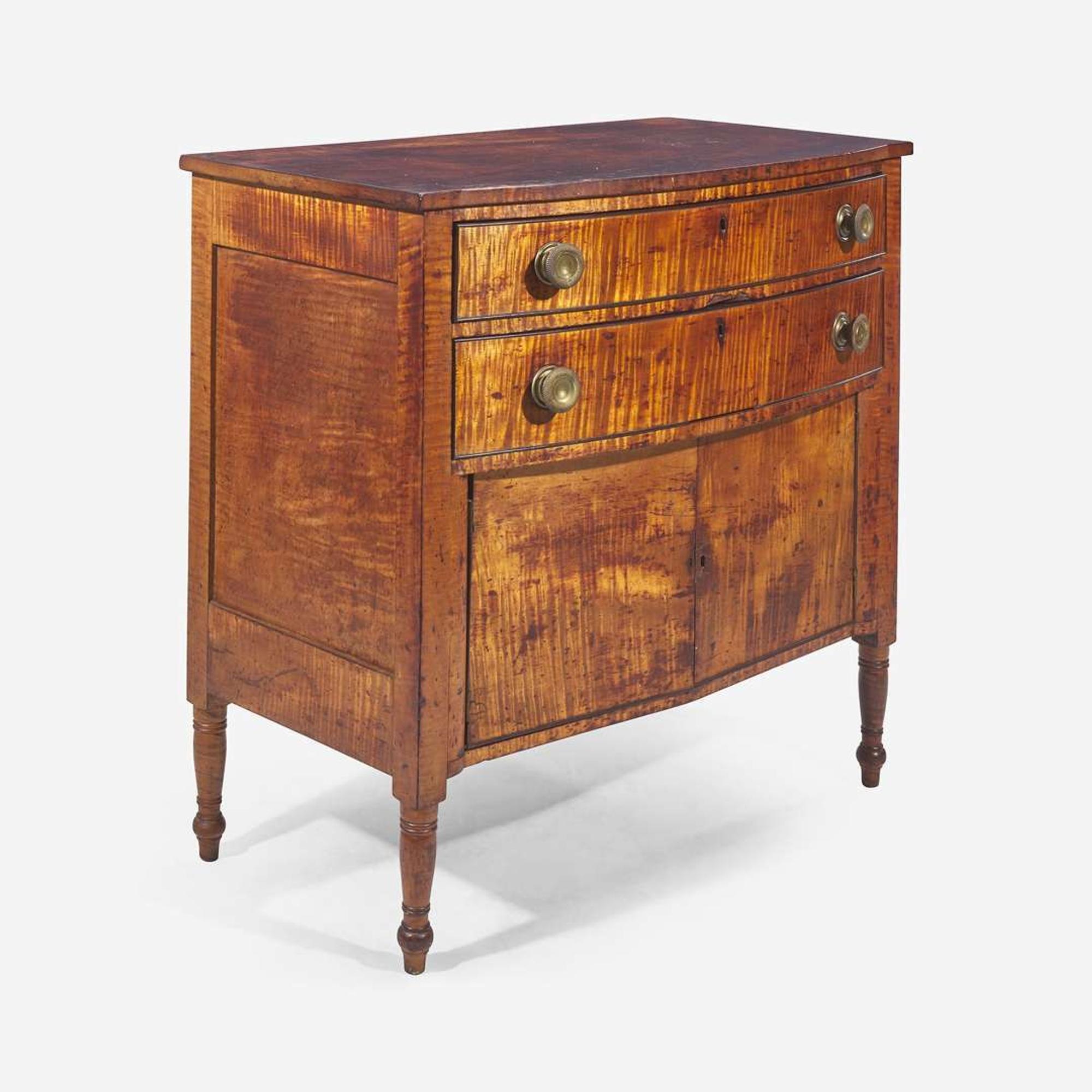 A Federal carved tiger maple bowfront dressing table together with tiger maple mirror early 19th century