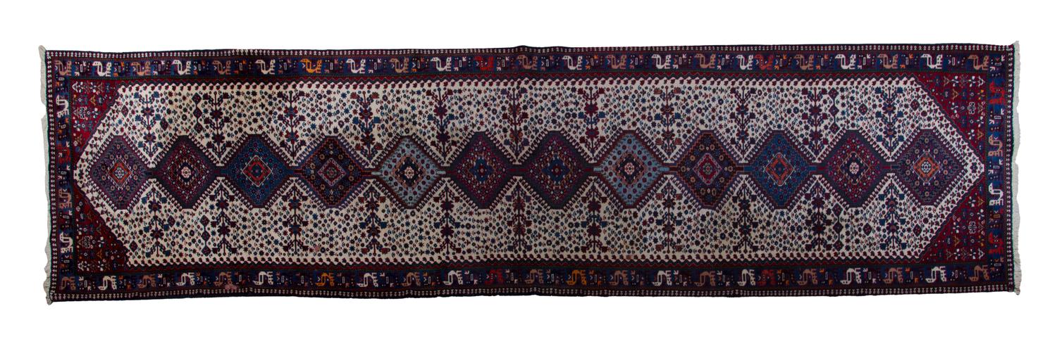A Yalamah Wool Runner, 16 feet x 3 feet 5 inches.