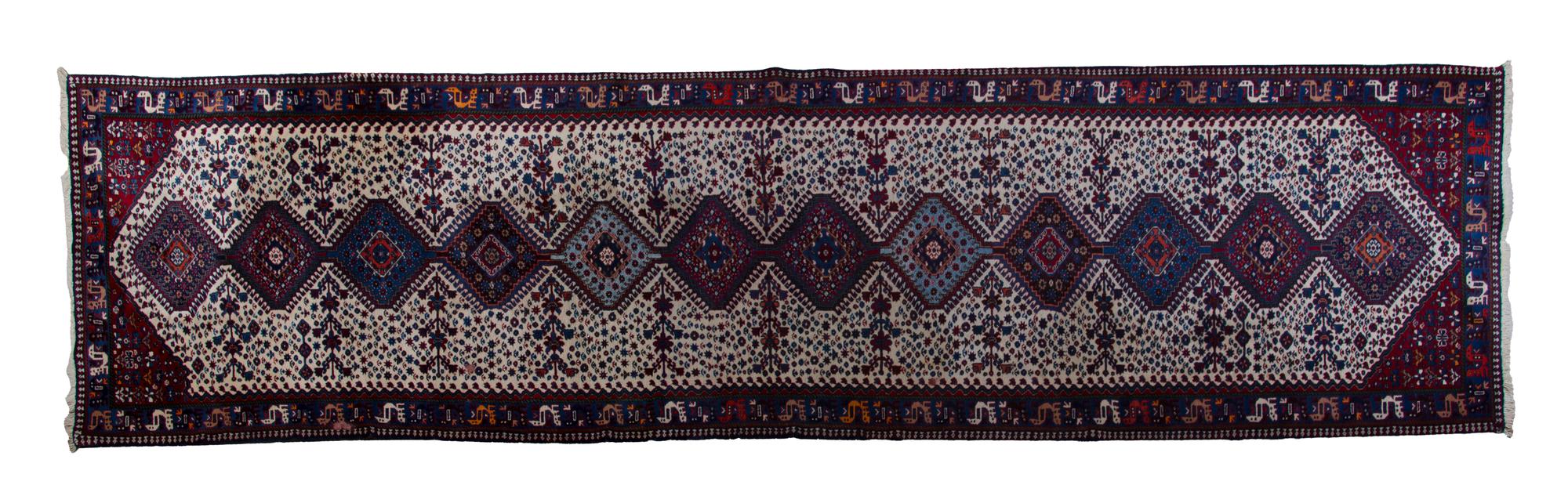 A Yalamah Wool Runner, 16 feet x 3 feet 5 inches.