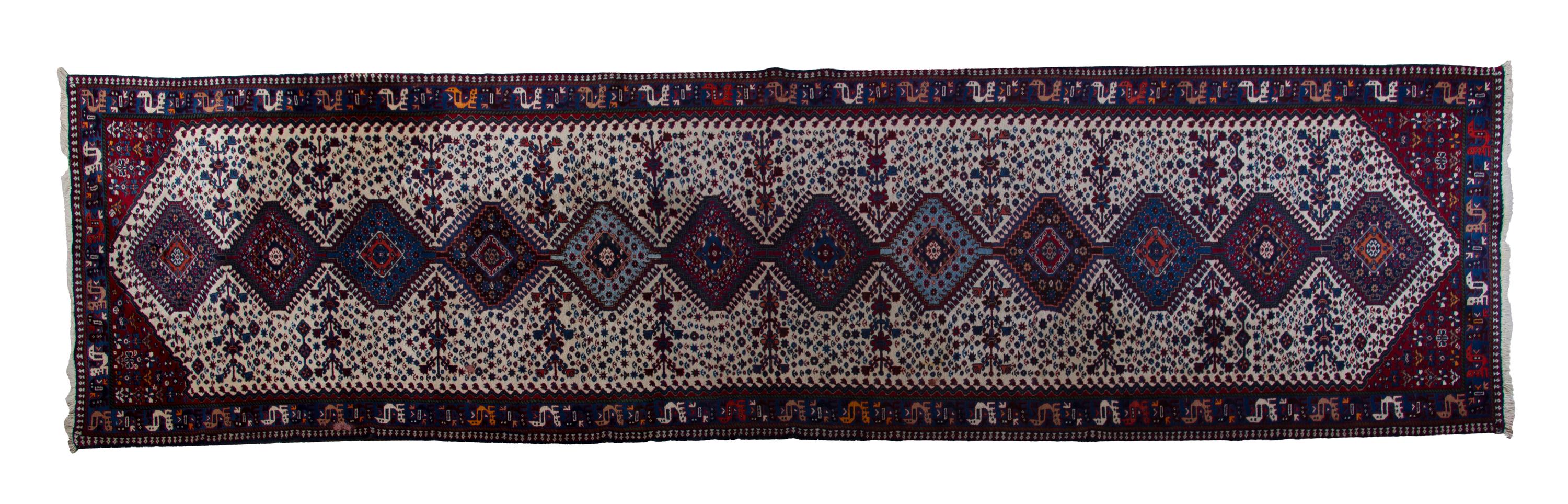 A Yalamah Wool Runner, 16 feet x 3 feet 5 inches.