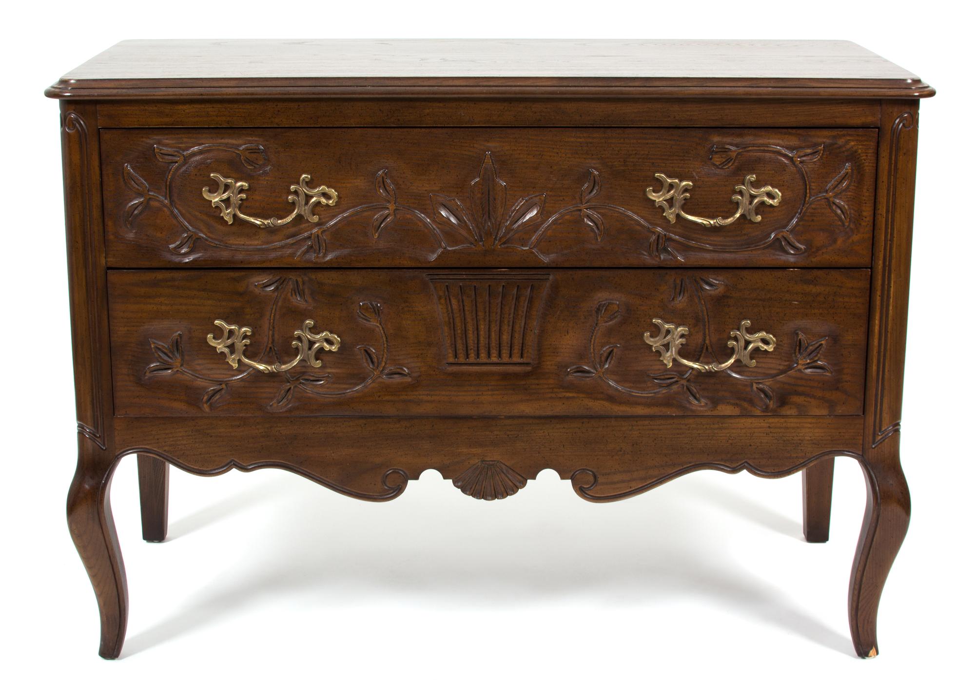 A French Provincial Style Carved Mahogany Chest of Drawers by Henredon — 20TH CENTURY