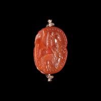 An Etruscan Carnelian Scarab with Warrior on Horseback and a Griffin — Set in a 19th Century gold swivel fob