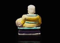 A Chinese glazed biscuit figure of Budai, Kangxi period 素三彩佈袋和尚 清康熙