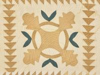 A Green and Tan Cotton Applique "Oak Leaf" Quilt