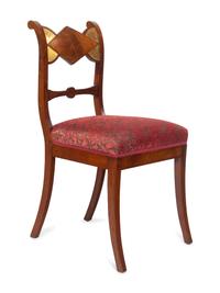A Set of Six German Parcel Gilt Mahogany Dining Chairs