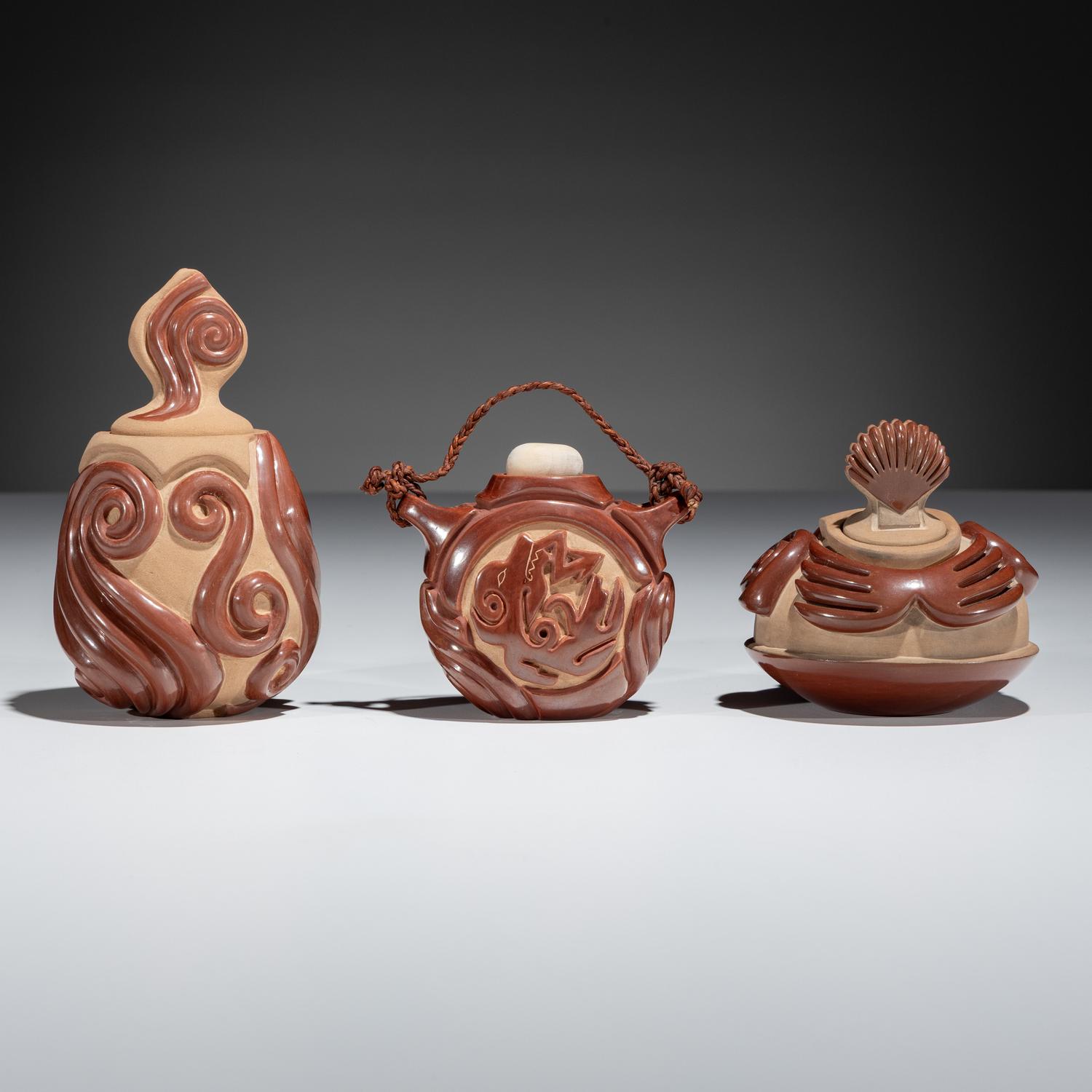 Red and Tan Carved Miniature Pottery