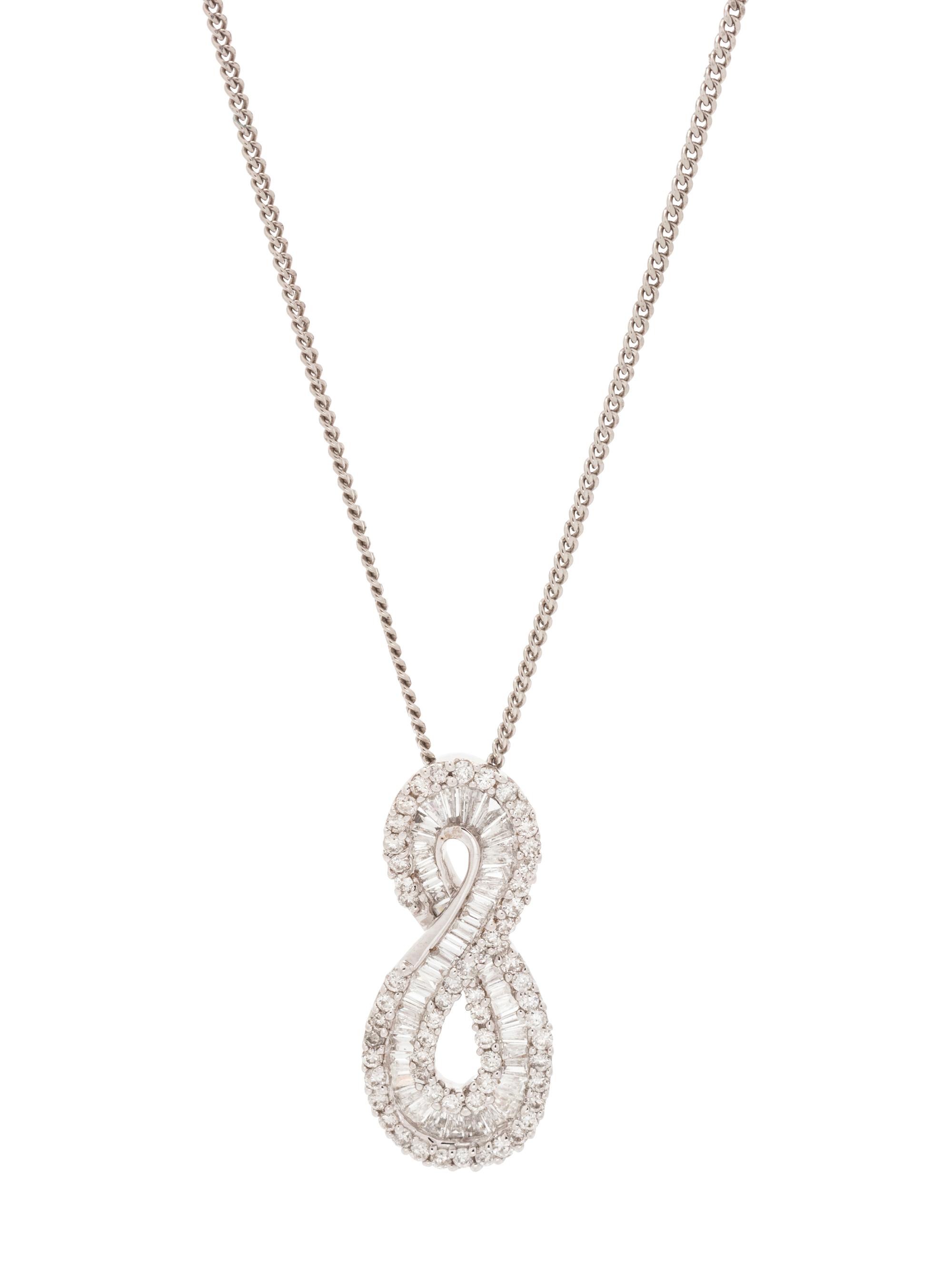 A 14 Karat White Gold and Diamond Pendant with Sterling Silver Chain,