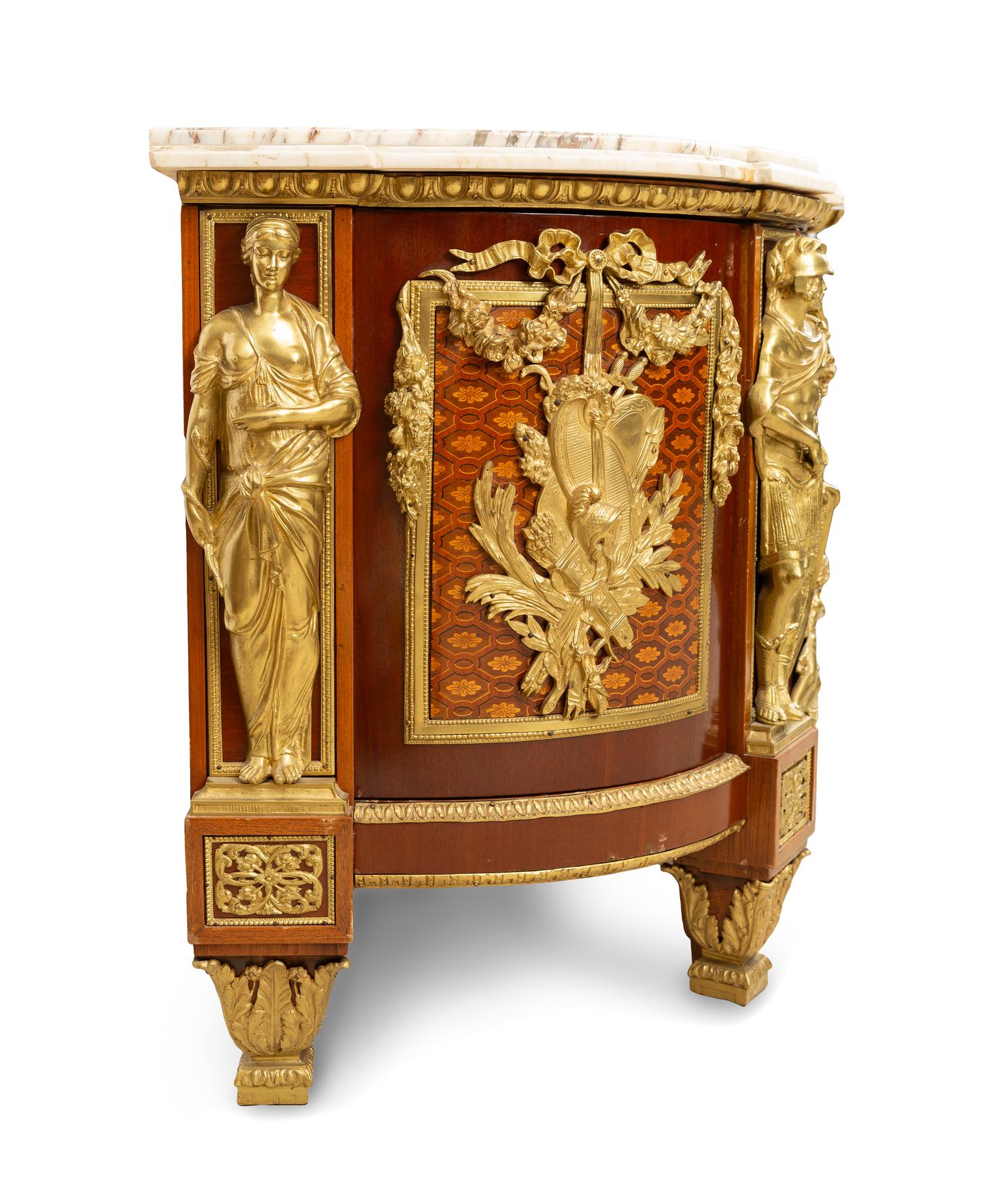 A Louis XVI Style Gilt Bronze Mounted Marquetry Commode