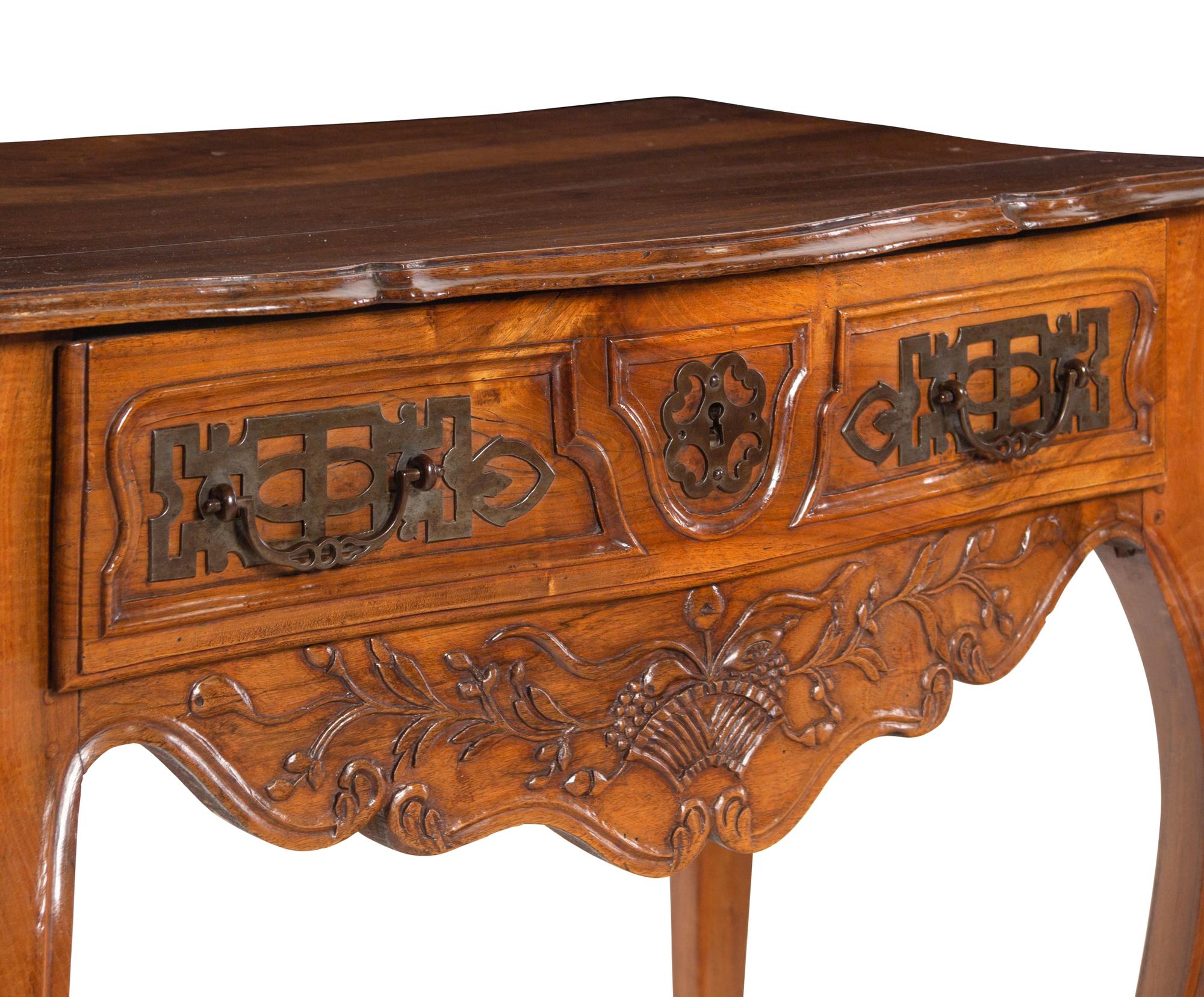A Louis XV Provincial Carved Walnut Table