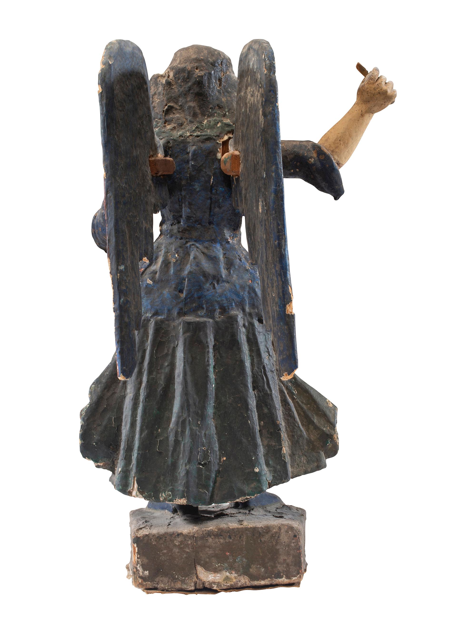 A Carved Polychrome Wood Santo Figure of San Miguel