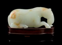 A Carved White Jade Figure of a Horse Length 3 3/4 inches. — 19TH CENTURY