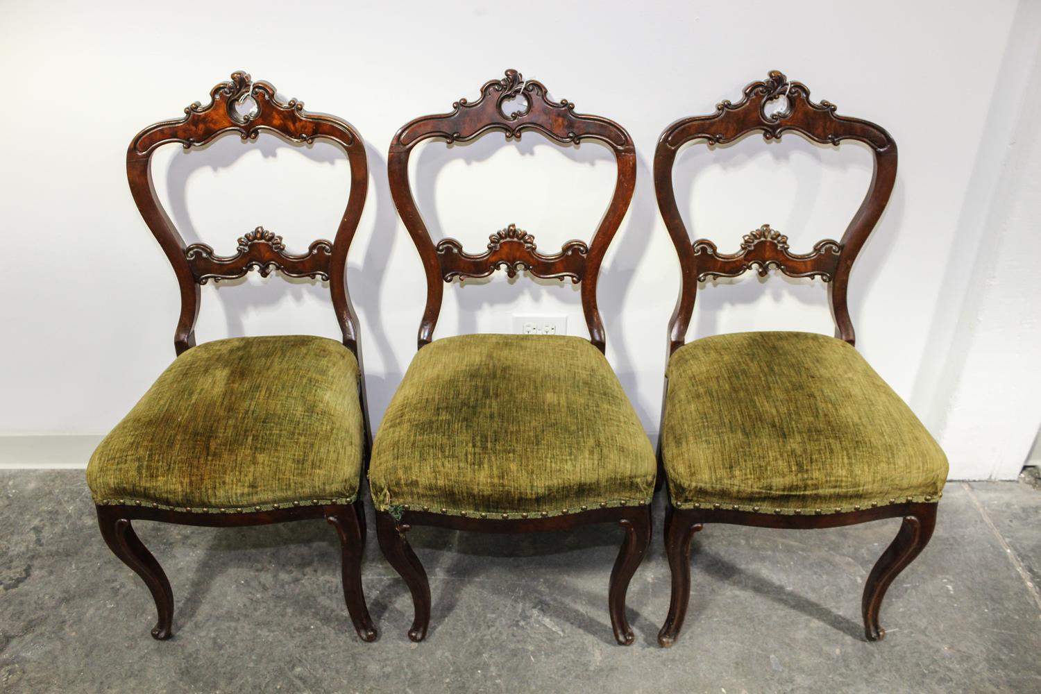 Three Victorian Walnut Side Chairs Height 38 inches.