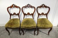 Three Victorian Walnut Side Chairs Height 38 inches.