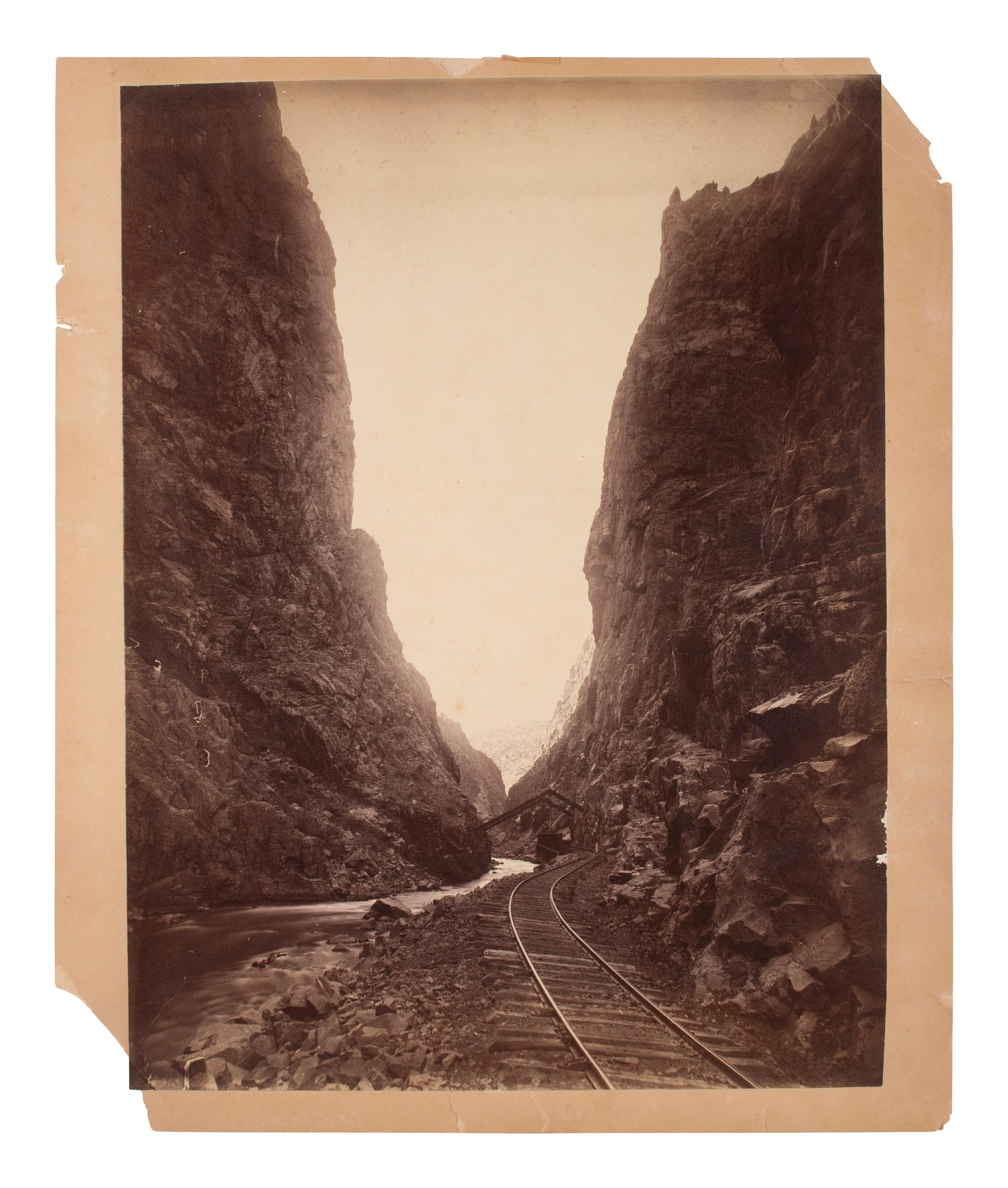 [WESTERN AMERICANA]. [JACKSON, W.H., photog.]. 2 photographs, incl. street scene and railroad view.
