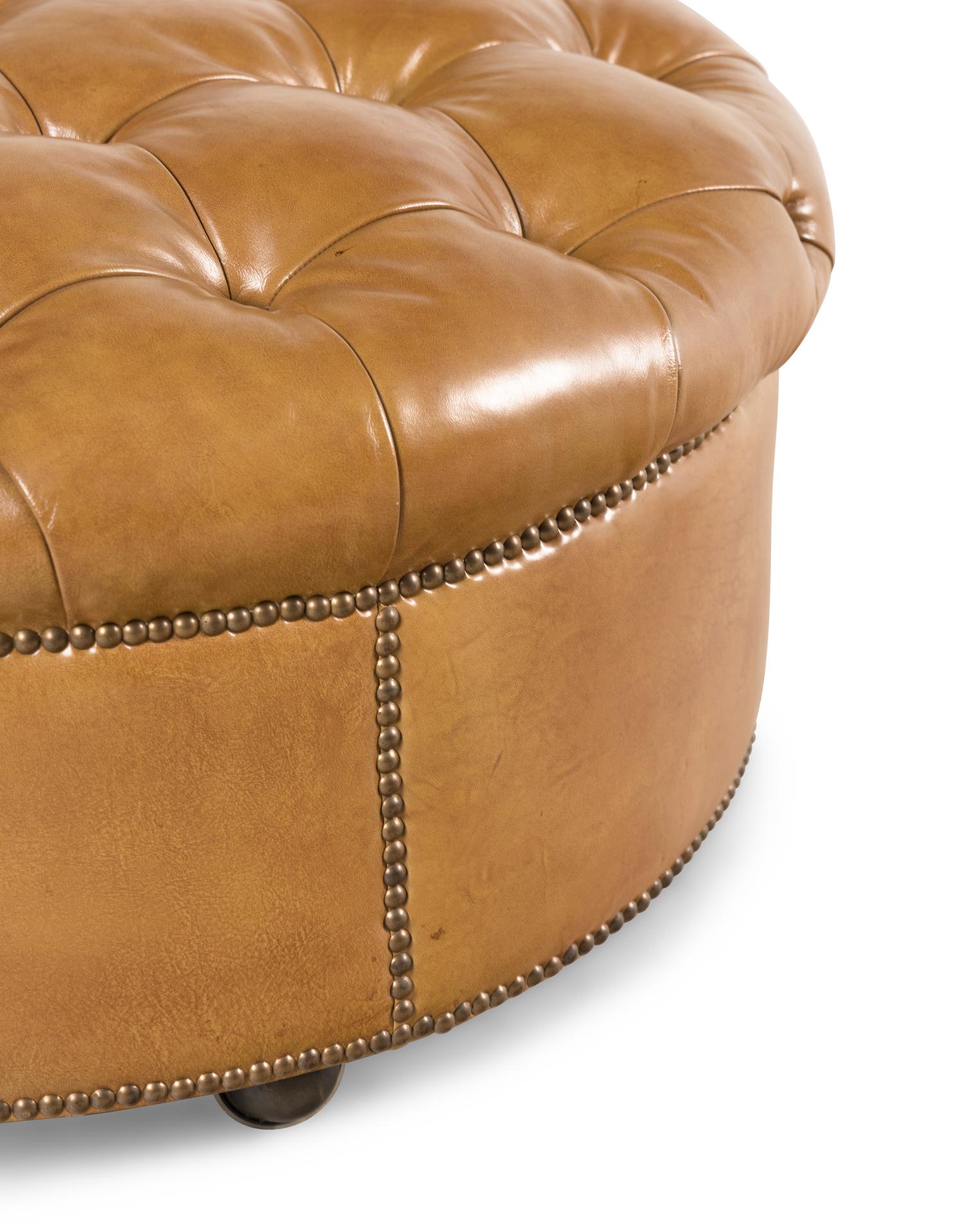 A Button-Tufted Leather Ottoman