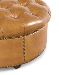 A Button-Tufted Leather Ottoman