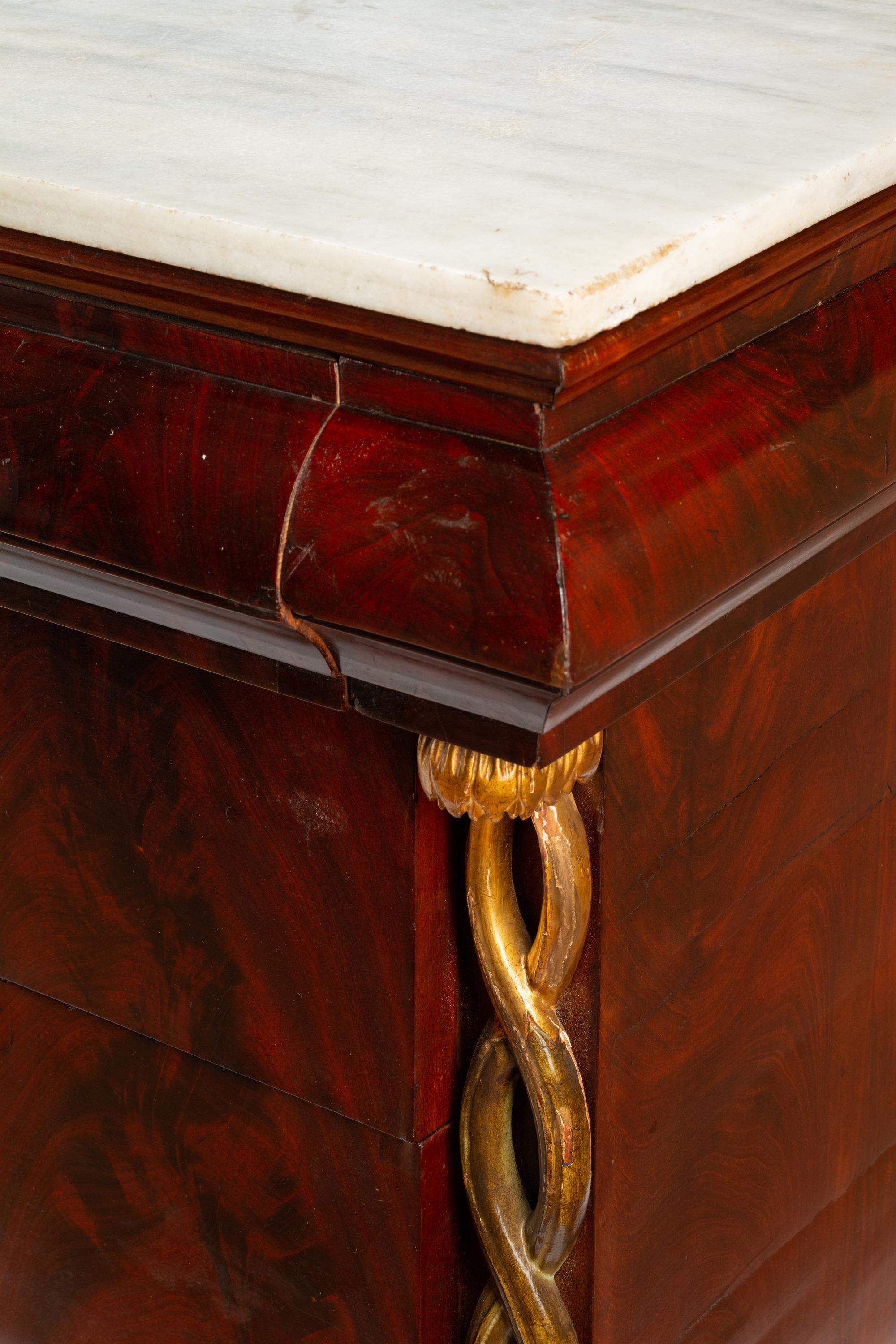 An Italian Parcel Gilt Mahogany Marble-Top Commode