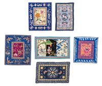 A Group of Ten Chinese and Japanese Style Rugs Largest 17 3/8 x 8 3/8 inches.
