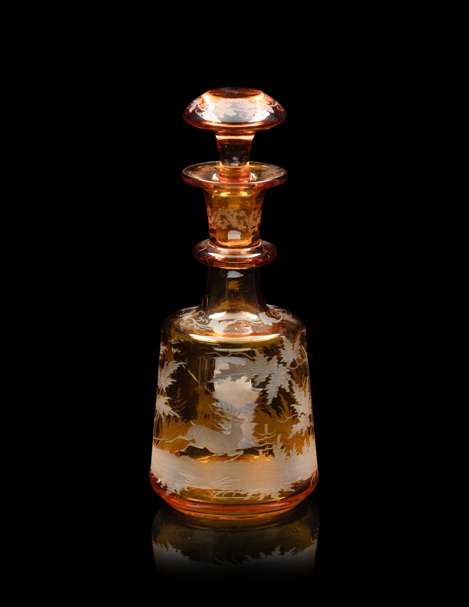 A Collection of Bohemian Amber Cut to Clear Glassware