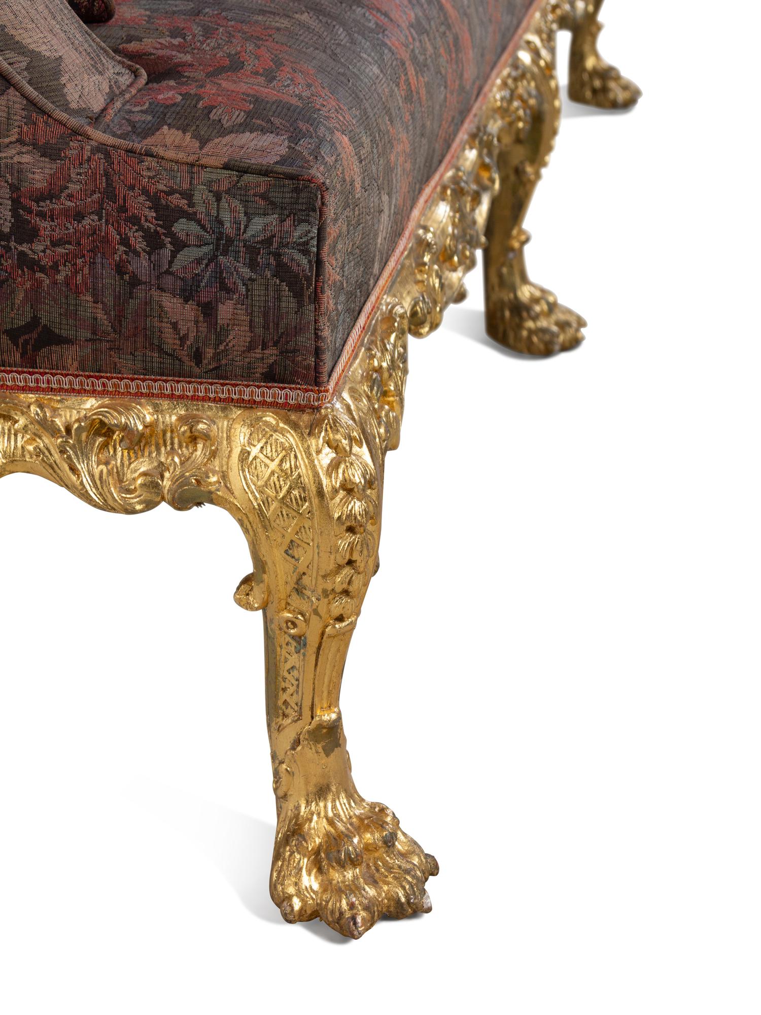 A Pair of George II Oversized Giltwood Canapés