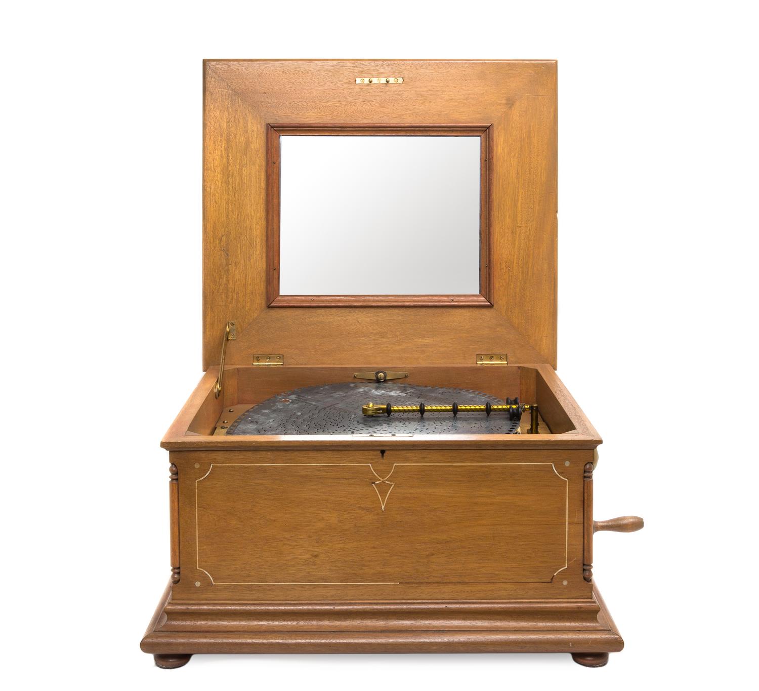 A Regina Disk Music Box, Height 12 1/2 x width 21 1/8 x depth 18 5/8 inches.