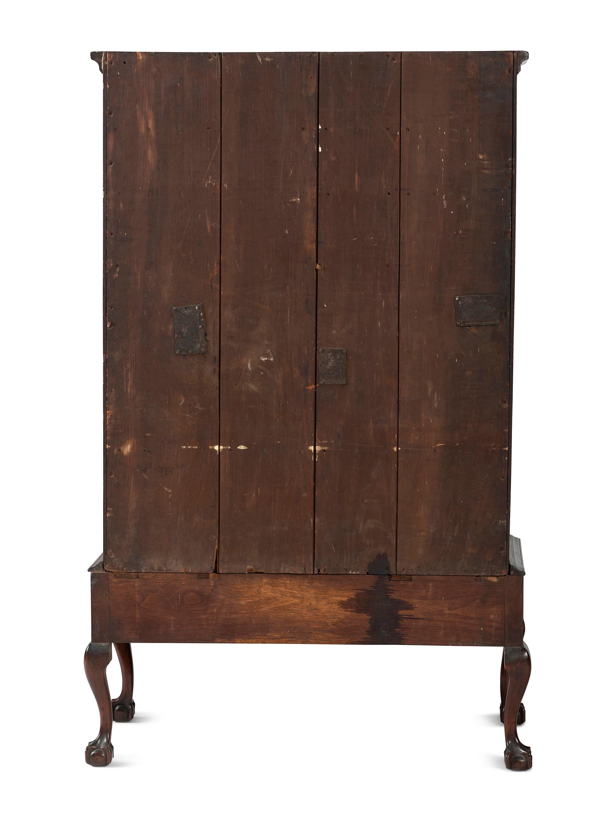 A Chippendale Carved and Figured Walnut Chest on Claw-and-Ball Foot Stand