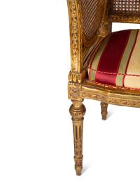 A Pair of Louis XVI Style Giltwood Cane-Back Benches