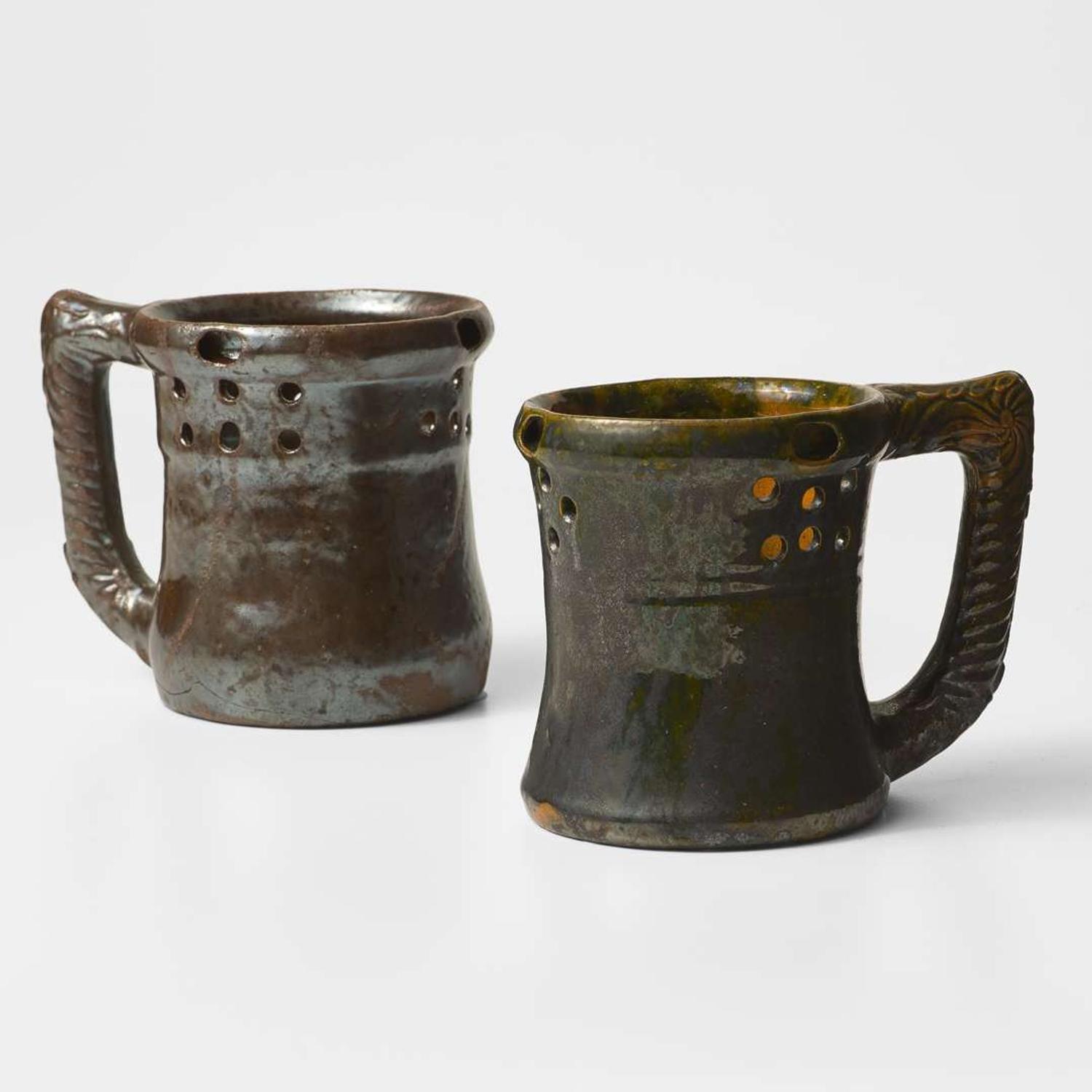 George Ohr (American, 1857-1918) Two Puzzle Mugs in Mirror Brown and Olive Glaze, Biloxi, Mississippi, USA, circa 1898-1910