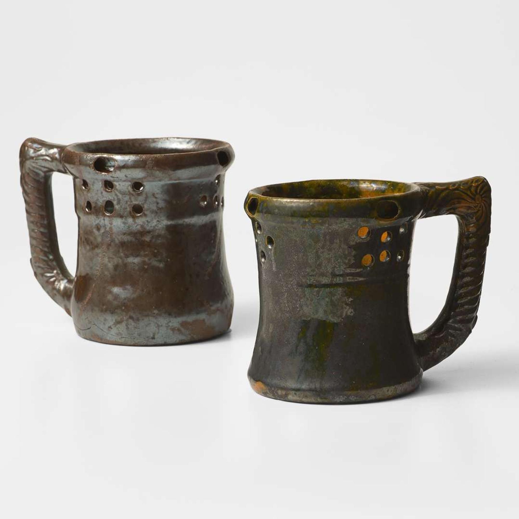 George Ohr (American, 1857-1918) Two Puzzle Mugs in Mirror Brown and Olive Glaze, Biloxi, Mississippi, USA, circa 1898-1910