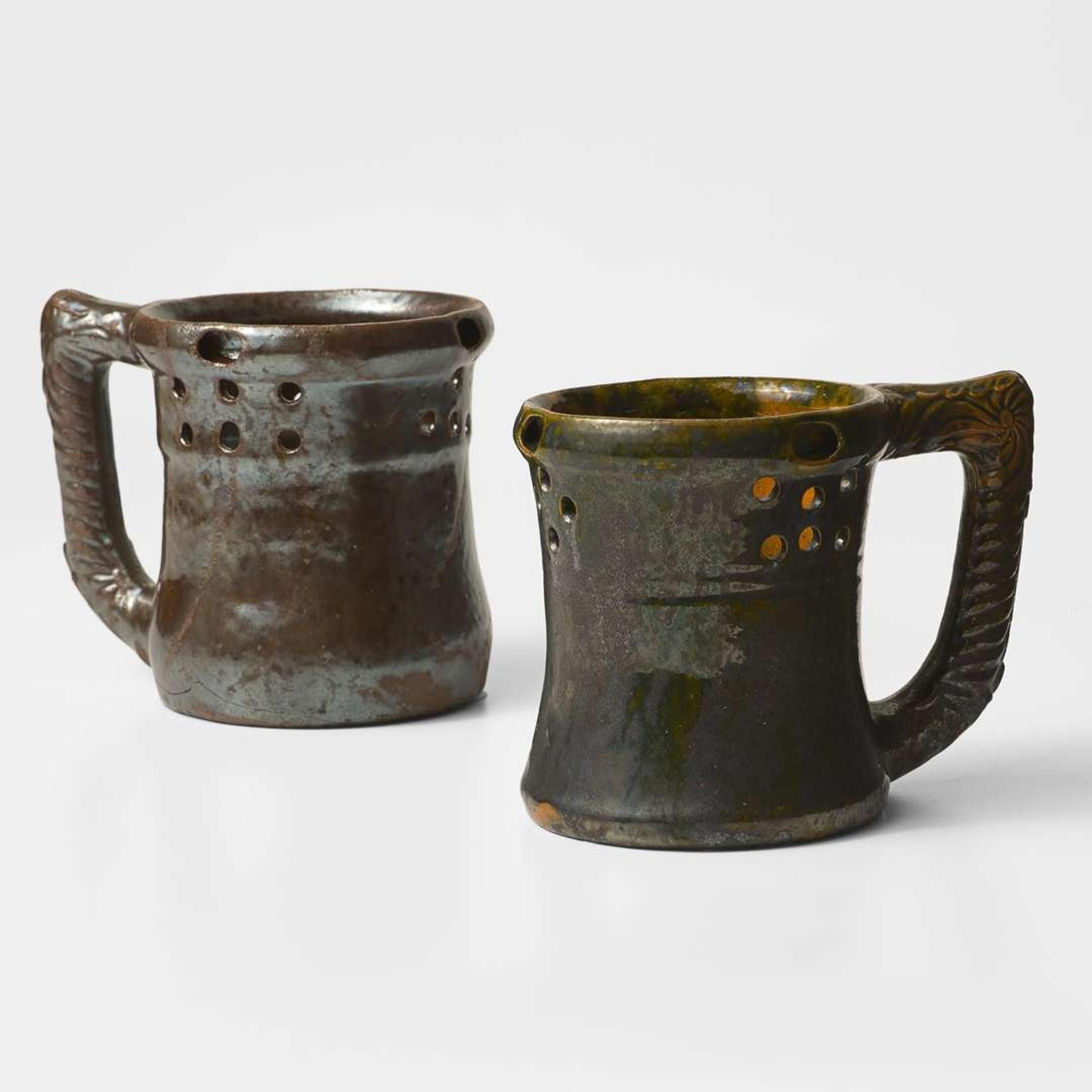 George Ohr (American, 1857-1918) Two Puzzle Mugs in Mirror Brown and Olive Glaze, Biloxi, Mississippi, USA, circa 1898-1910