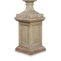 A Pair of Carved Granite Urns and Plinths
