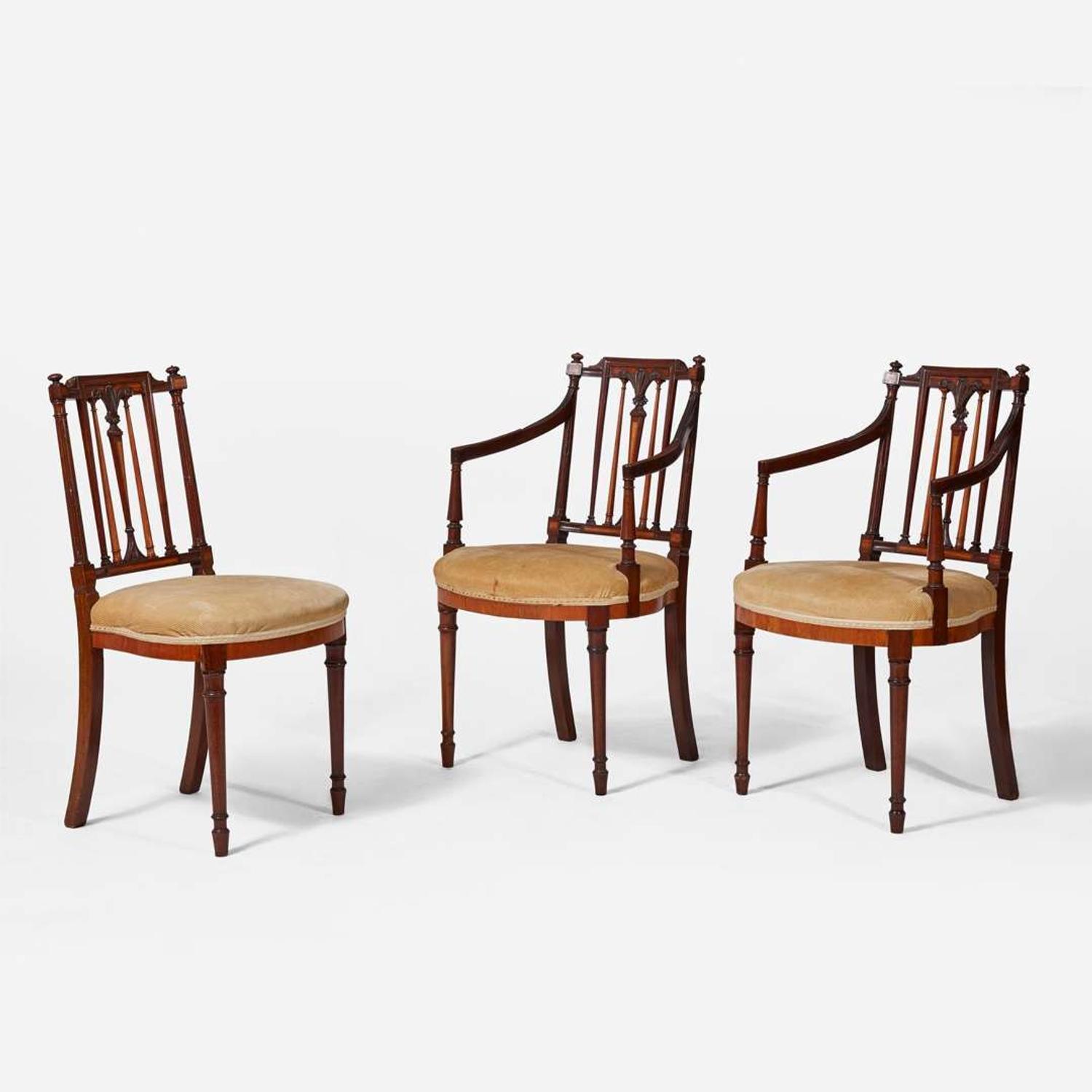 A group of three George III inlaid mahogany and satinwood dining chairs circa 1790