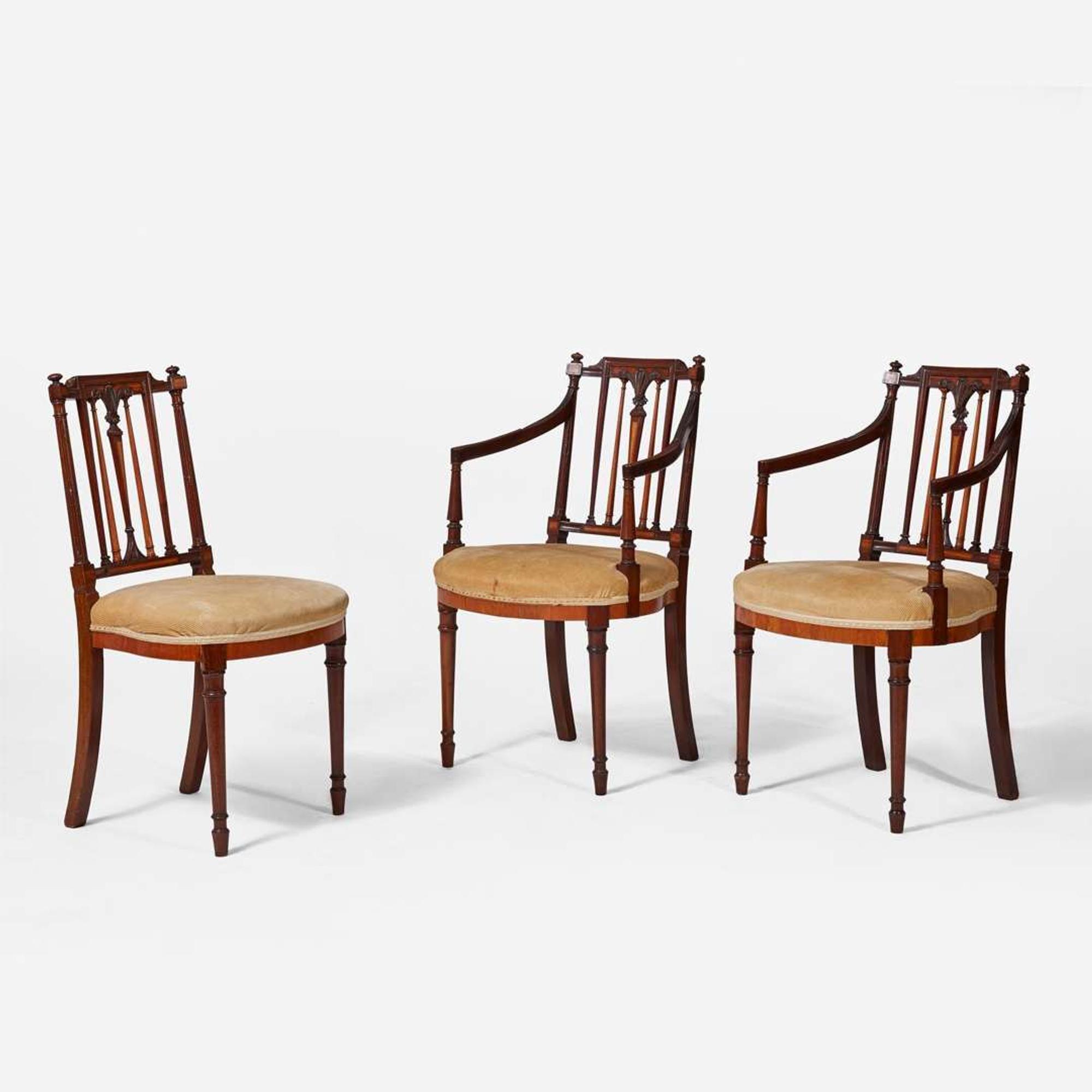 A group of three George III inlaid mahogany and satinwood dining chairs circa 1790