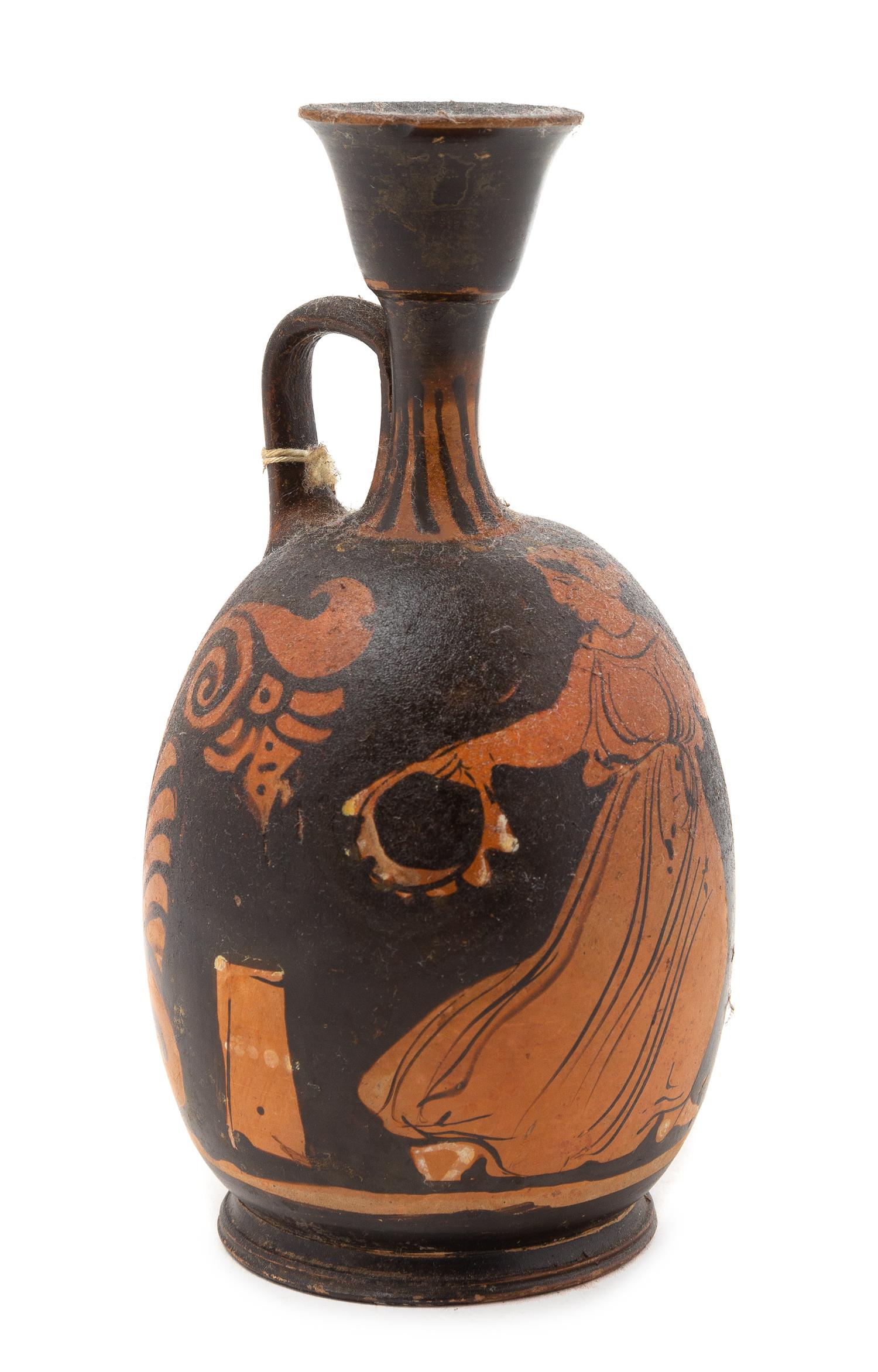 An Apulian Red Figured Squat Lekythos Height 6 5/8 inches. — CIRCA 340-320 B.C.E.